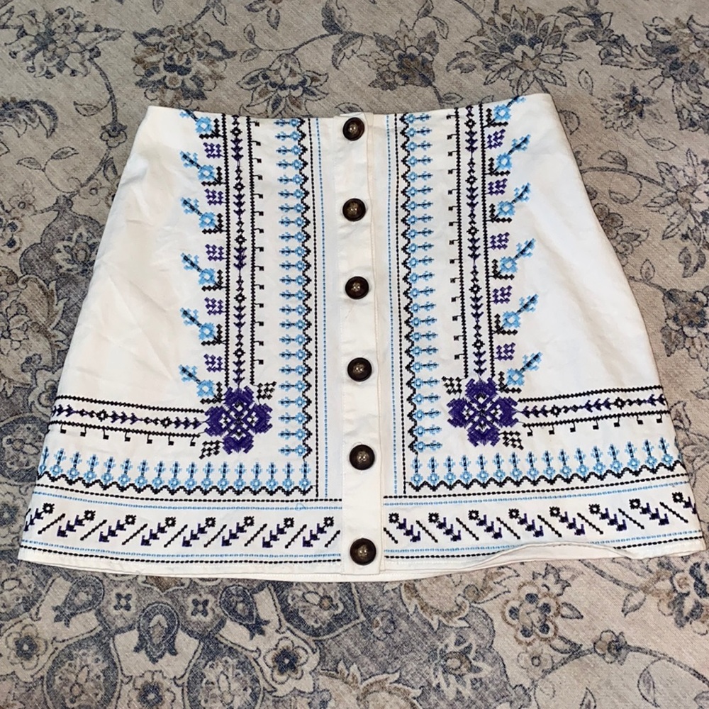 White With Blue Threaded Details